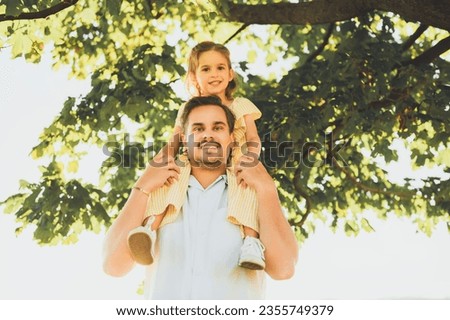 A Happy family father with children daughter on nature sunset