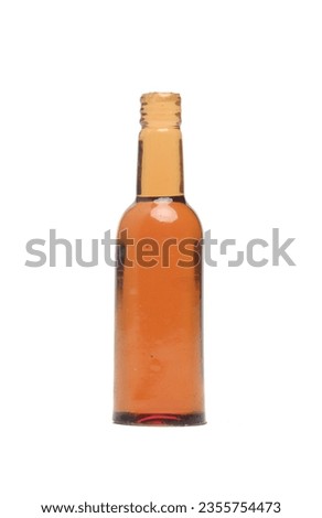 A picture of empty glass bottle with   on white background