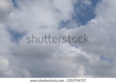 Blue sky and white clouds nature to create a beautiful background and texture clsoseup.