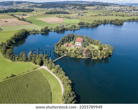 Aerial view of the Mauern Lake with an old, little castle on the small island Royalty-Free Stock Photo #2355789949