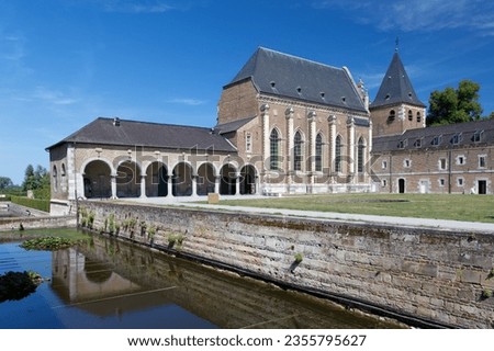 The church and annex of the Castle Alden Biesen in Limburg, Belgium Royalty-Free Stock Photo #2355795627