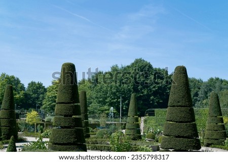 Alden biesen castle french garden in Limburg, Belgium in summer. Royalty-Free Stock Photo #2355798317