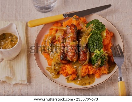 Cumberland sausages with mashed sweet potato,broccoli and a mustard onion gravy.