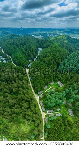 Aerial photography of the summer countryside scenery in Anshun, Guizhou, China. It has pristine forests and mountain villages, and is becoming the best summer resort in China.