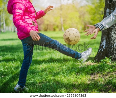 photo close-up of girl playing with ball