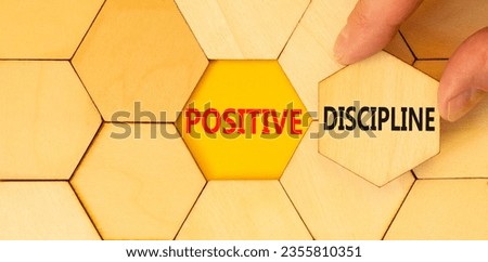 Positive discipline symbol. Concept words Positive discipline on beautiful wooden puzzles. Beautiful yellow paper background. Business psychology positive discipline concept. Copy space.