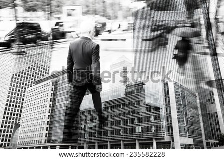 multi exposure picture of a businessman walking in the city and a cityscape with office buildings
