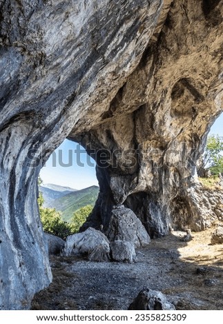 The huge arch of the outlaw surah, in the Oltet gorges, Gorj, Romania Royalty-Free Stock Photo #2355825309