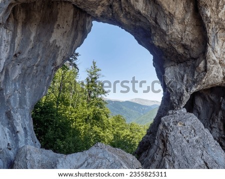 The huge arch of the outlaw surah, in the Oltet gorges, Gorj, Romania Royalty-Free Stock Photo #2355825311