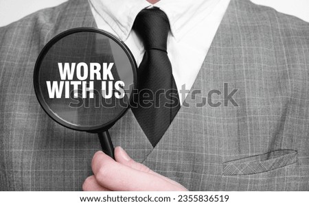 WORK WITH US words on magnifying glass and businessman