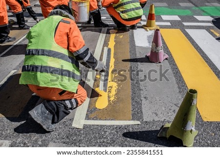 Drawing road markings on the road in the city