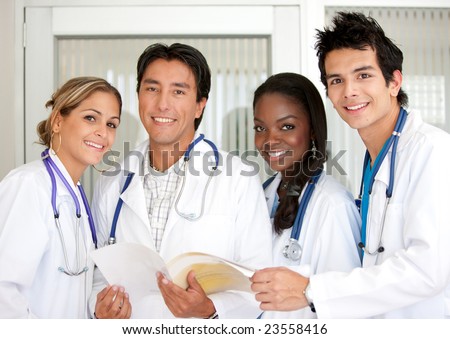 small group of doctors standing together in a hospital room