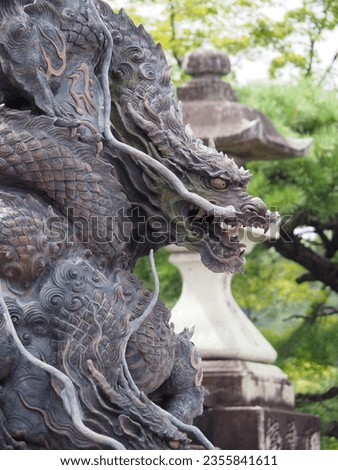 big stone dragon in front of a japanese temple in kyoto