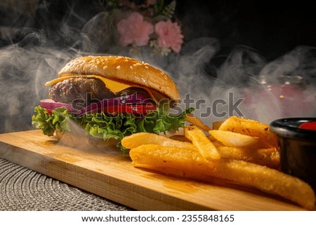 Indulge in the ultimate comfort food experience with this mouthwatering snapshot of a perfectly crafted hamburger.