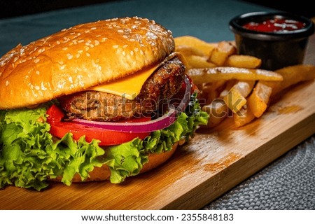 Indulge in the ultimate comfort food experience with this mouthwatering snapshot of a perfectly crafted hamburger.