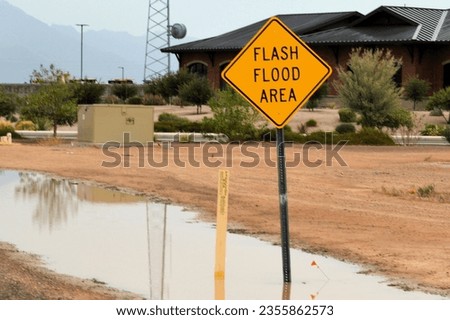flooded street area in Maricopa Arizona after summer monsoon storm Royalty-Free Stock Photo #2355862573