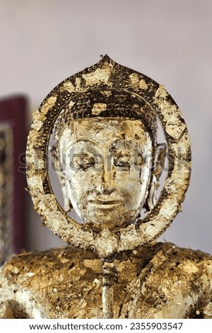 Close up Ancient Golden Buddha Image at Wat Rakhang Kositaram Woramahawihan Temple, Bangkok Thailand.
