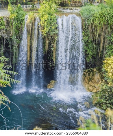 Upper Duden Waterfall is called as Alexander Falls. The paradise like hinterland of the waterfall is all in green in Antalya, Turkey. Tourism and travel destination photo