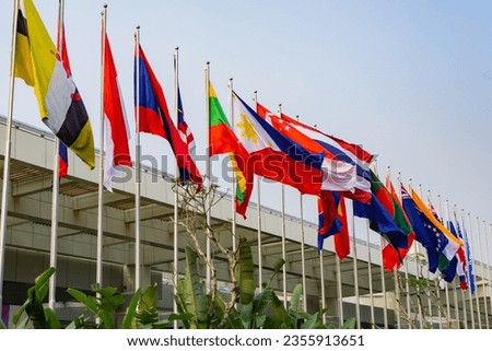Flags of ASEAN member countries and delegate countries line the Jakarta Convention Center for the ASEAN Summit Royalty-Free Stock Photo #2355913651
