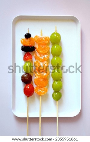 Tanghulu, a fruit skewer Korean snack candy coated with sugar syrup Royalty-Free Stock Photo #2355951861