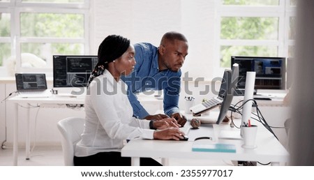 African Business Team Working On Computer. Software App Development Royalty-Free Stock Photo #2355977017