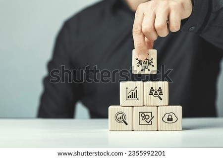 Assembled wooden cubes on the topic of the application of artificial intelligence in business.
