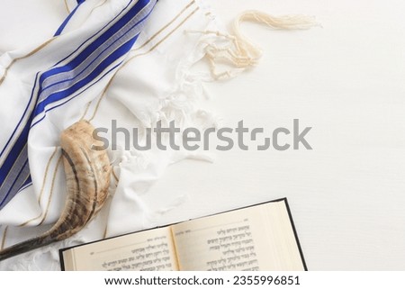 religion image of shofar (horn) on white prayer talit. Rosh hashanah (jewish New Year holiday), Shabbat and Yom kippur concept Royalty-Free Stock Photo #2355996851