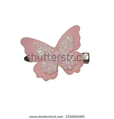 Beautiful pink glitter butterfly hair clip against a white background. Royalty-Free Stock Photo #2356026483