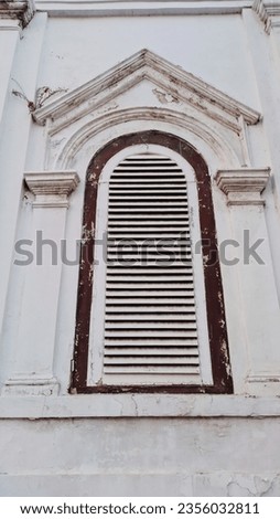 A window in a Dutch colonial era building around Kota Lama, Semarang, Central Java, Indonesia. SHOTLIST1990