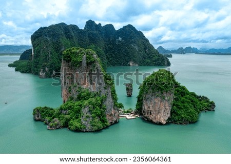 Khao Tapu, James Bond Island, aerial shot from a drone, blue sea, emerald green, is a popular tourist attraction in Southern Thailand. Royalty-Free Stock Photo #2356064361