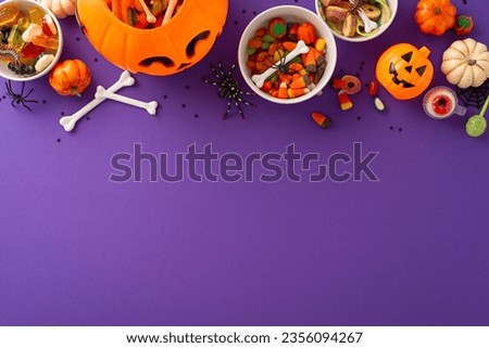 Enchanting children's trick or treat festivity. Bird's-eye perspective capturing a pumpkin basket with treats and Halloween decorations on a purple isolated background, ample space for text or advert