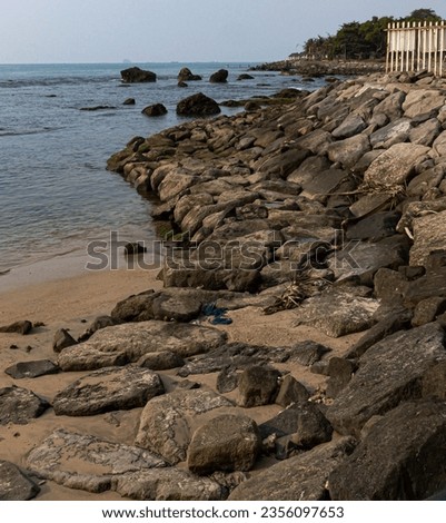 Rocks at a beach near Cikoneng Lighthouse in Anyer, Banten Province, Indonesia in the afternoon
