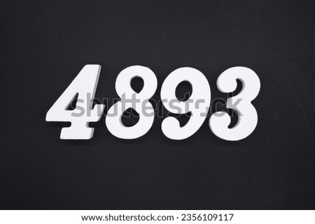 Black for the background. The number 4893 is made of white painted wood.