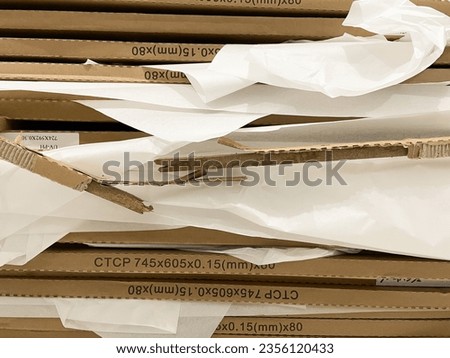 Stack of cardboard, pile of waste corrugated cardboard used in packaging for recycling isolated.
