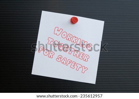 Text working together for safety on note paper 