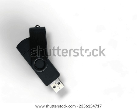 Black USB flash drive isolated on white.