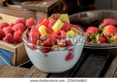 Wholesome Indulgence: 4K Close-Up of Healthy Yogurt with Fresh Strawberries and Berries Royalty-Free Stock Photo #2356166863