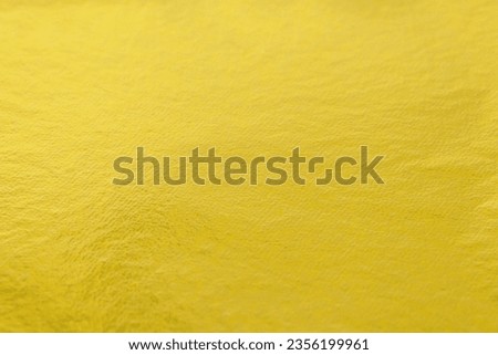 Edible gold leaf sheet as background, closeup Royalty-Free Stock Photo #2356199961