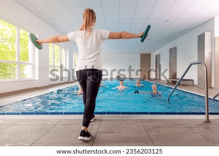 Training class in water gymnastics at a rehabilitation gym