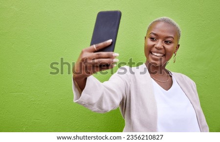 Young African woman, selfie and wall with smile, excited face and photography for web blog by green background. Happy influencer, memory and profile picture with update, post and social network app