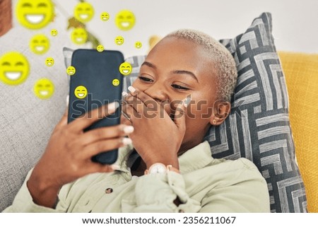 Black woman on sofa with phone, laughing and emoji on social media, message or video online. Happy face, smile and internet, girl on couch with digital app on smartphone and funny viral meme in home. Royalty-Free Stock Photo #2356211067