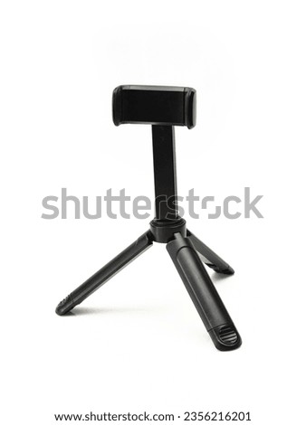 Small tripod stand for phones isolated on white background Royalty-Free Stock Photo #2356216201