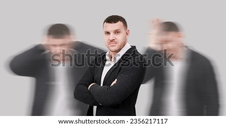 Man amidst chaos remains composed, Concept of overcoming negative emotions Royalty-Free Stock Photo #2356217117