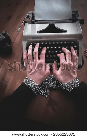 a journalist, writer, or screenwriter whose writing is censored. Royalty-Free Stock Photo #2356223891
