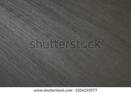 Graphite background. The texture is decorative with a strip