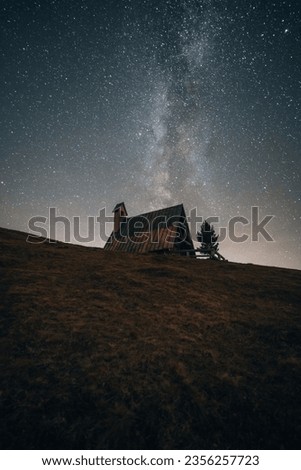 Astro photo of small church at Passo Giau pass in Dolomites South Tyrol Italy Royalty-Free Stock Photo #2356257723