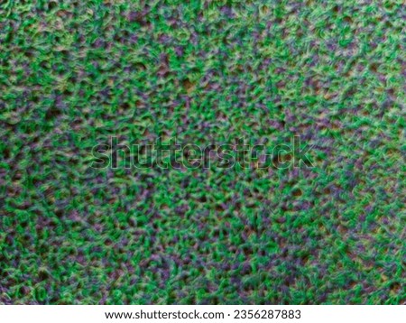 
Closeup photo of green and purple carpet background with texture