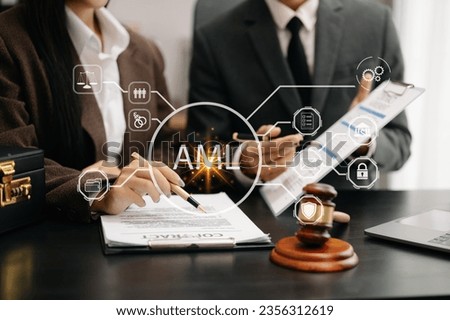 AML Anti Money Laundering Financial Bank Business Concept. judge in a courtroom using laptop and tablet with AML anti money laundering icon on virtual 
 Royalty-Free Stock Photo #2356312619
