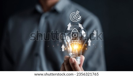Business journey of a rocket icon inside lightbulb, accelerate towards your goals, rapid startup momentum. sights are set on achieving success, forward with determination and innovation Royalty-Free Stock Photo #2356321765