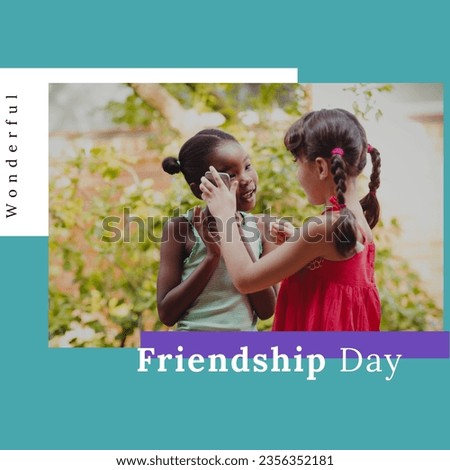 Wonderful friendship day text over two diverse girls using smartphone against blue background. friendship day celebration and awareness concept
